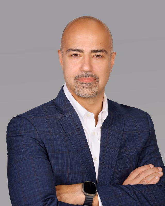 Samer Jalloul, founder of SJ Ventures, in a navy suit jacket and white shirt